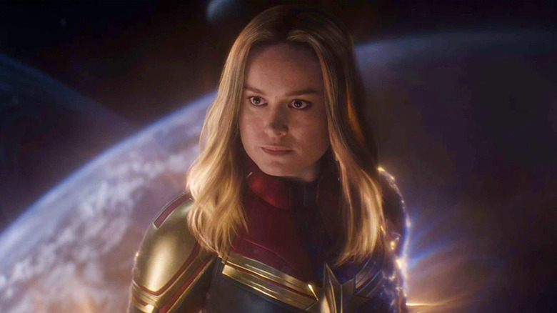 Captain Marvel flying over Earth