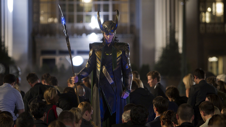 Loki with scepter in front of crowd