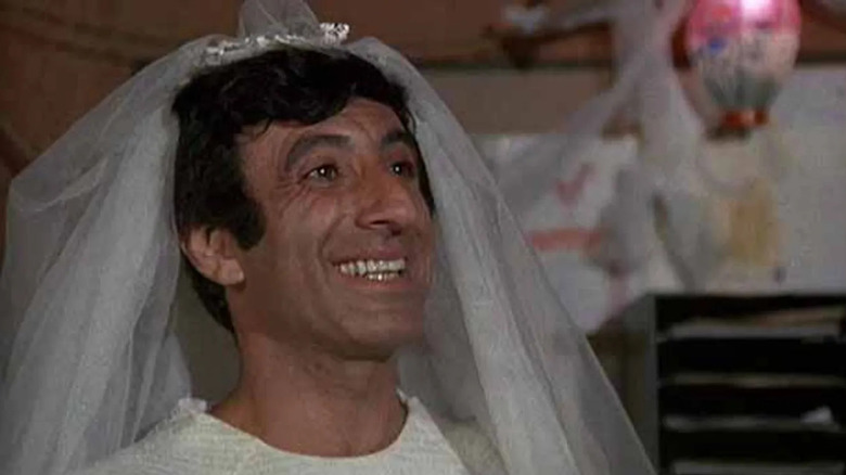 Klinger wearing a wedding dress