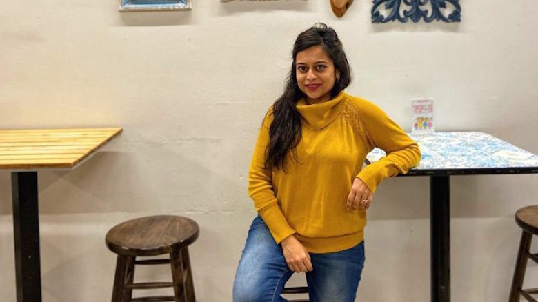 Garima Kothari poses in a restaurant