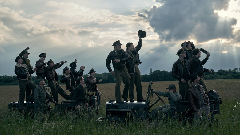 Airmen standing in field