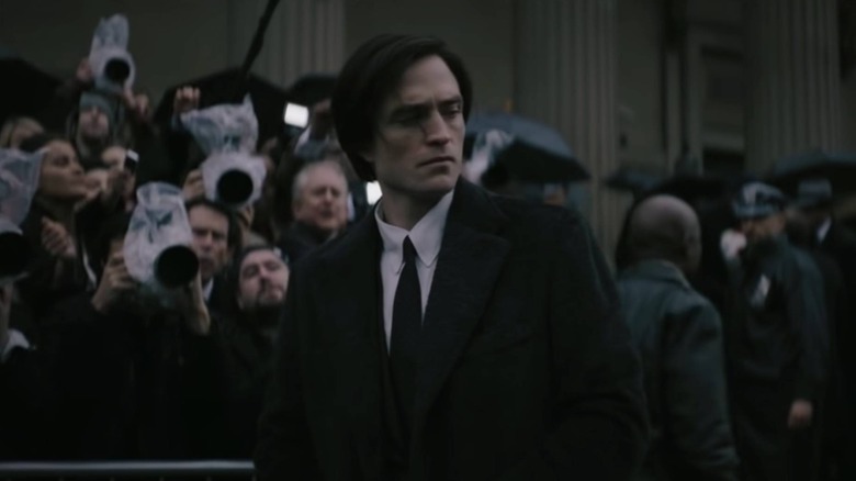 Bruce Wayne attending a funeral