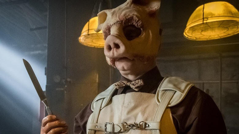 Professor Pyg holding a knife