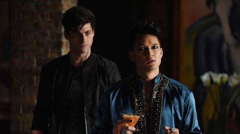 Alec and Magnus look to the side