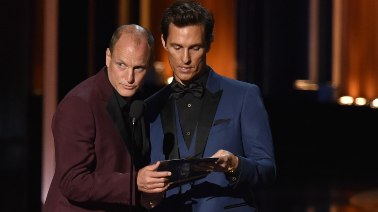 Woody Harrelson and Matthew McConaughey sharing a microphone