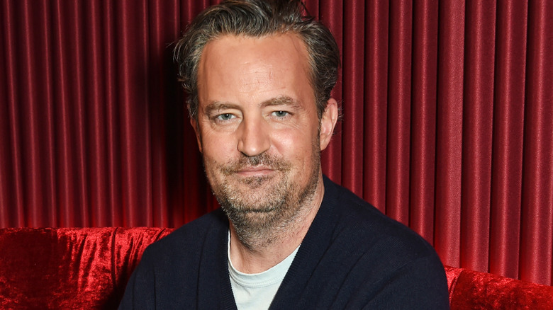 Matthew Perry smirking