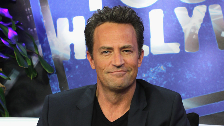 Matthew Perry smirking