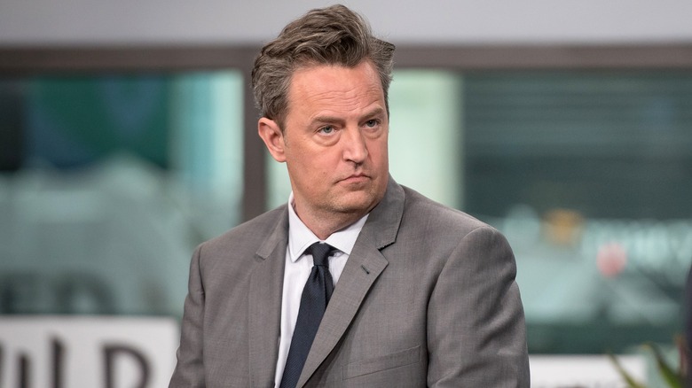 Matthew Perry staring