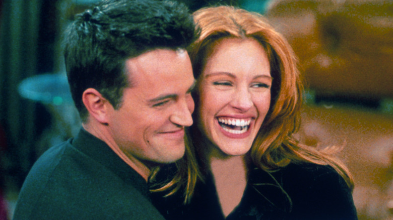 Matthew Perry hugging Julia Roberts