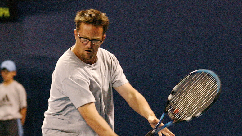 Matthew Perry playing tennis