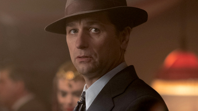 Matthew Rhys wears a fedora