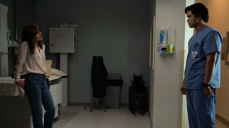 Elizabeth and Joe standing in a doctor's office