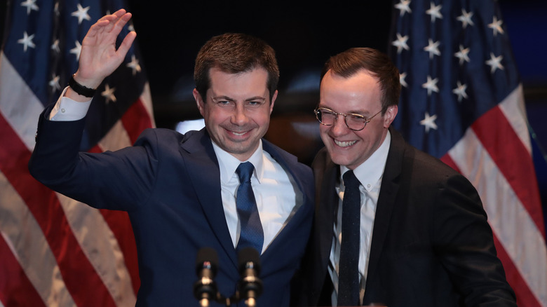 Pete and Chasten Buttigieg at podium