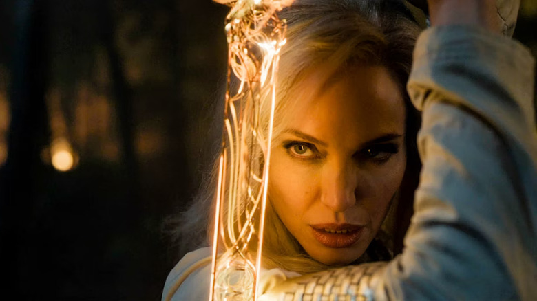 Jolie as Thena with a glowing sword