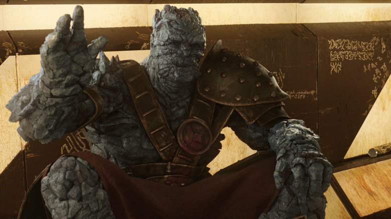 Korg waving to new prisoners