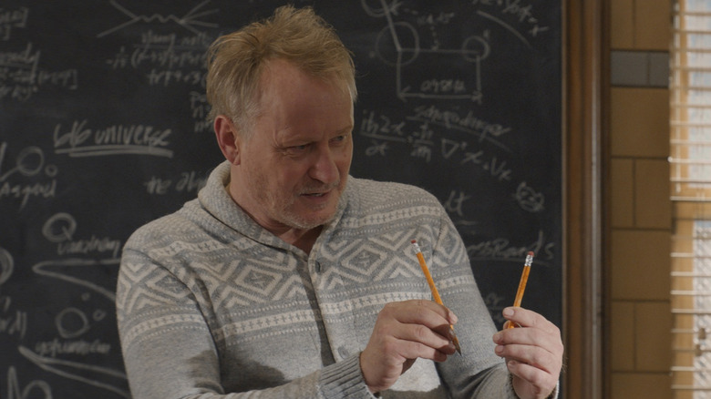 Stellan Skarsgard holds two pencils