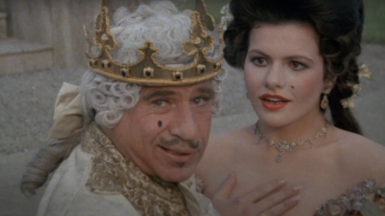 Mel Brooks smirking as king