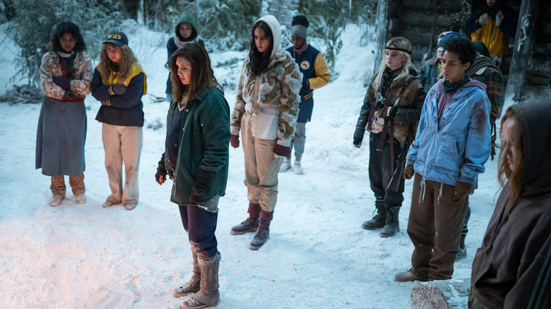 Shauna and girls huddled in snow