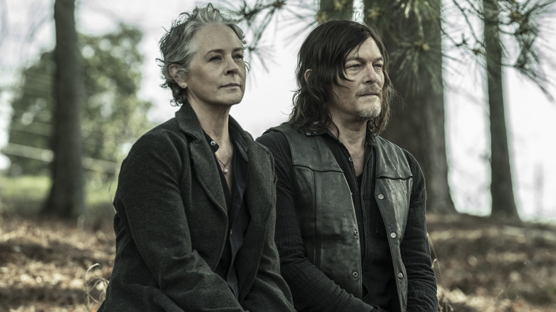 Carol and Daryl sitting on a bench 