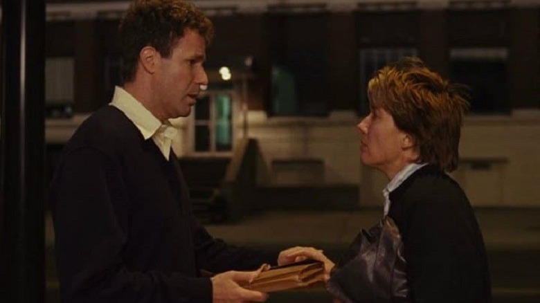 Harold Crick and Karen Eiffel stand face to face on a street corner at night 