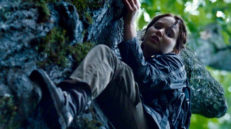 Katniss climbing a tree