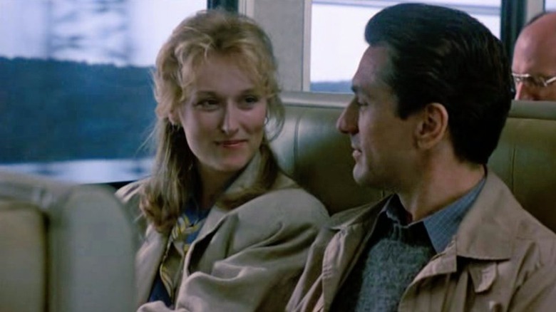 Streep and De Niro sitting on train