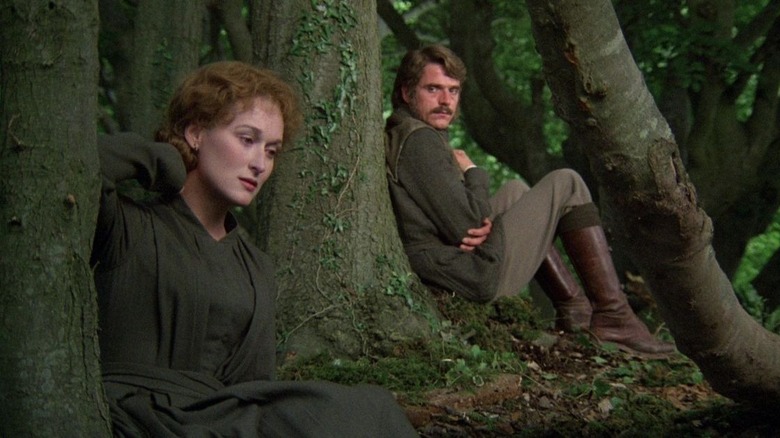 Streep and Kline sitting in woods