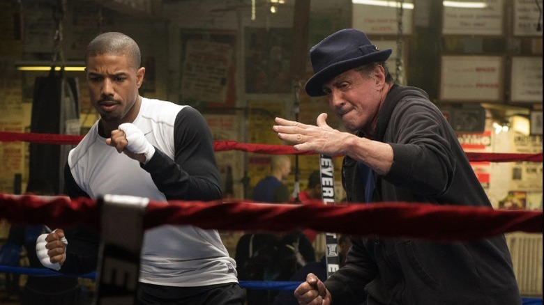 Rocky Balboa in a ring with Adonis Creed