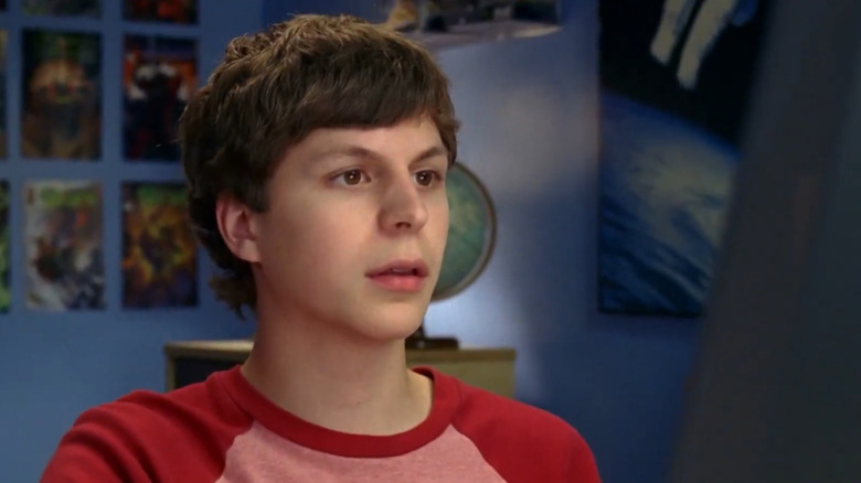 Michael Cera looks at a computer