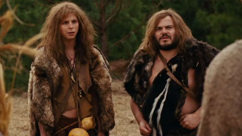 Michael Cera and Jack Black dressed as cavemen