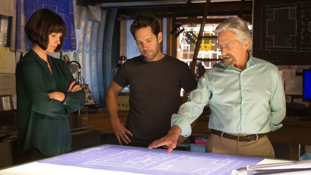 Hank Pym gestures to blueprints for Scott and Hope