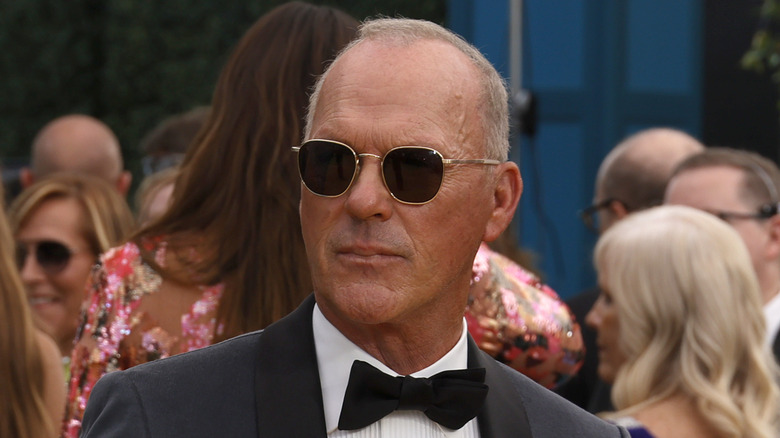 Michael Keaton wearing sunglasses and a bowtie