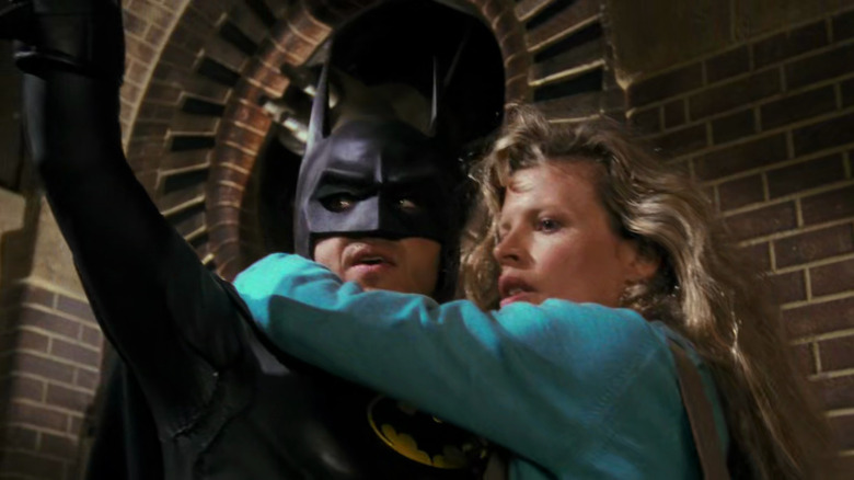 Batman holds Vicki