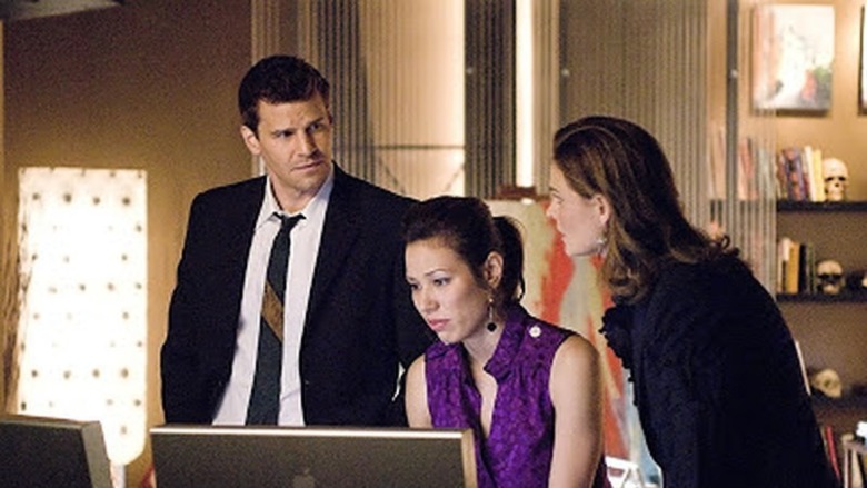 Booth, Angela, and Brennan at a computer in Bones