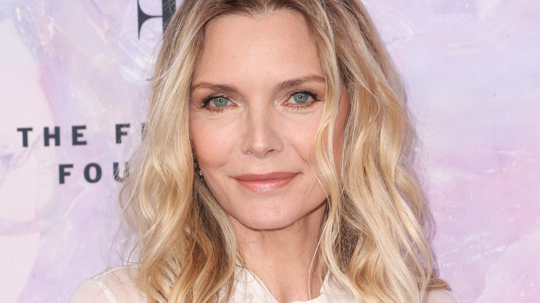 Michelle Pfeiffer smiling into camera