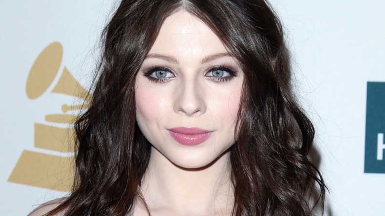 Michelle Trachtenberg posing for photo