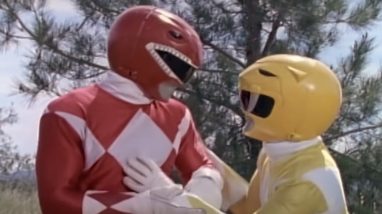 Yellow Ranger holding Red Ranger