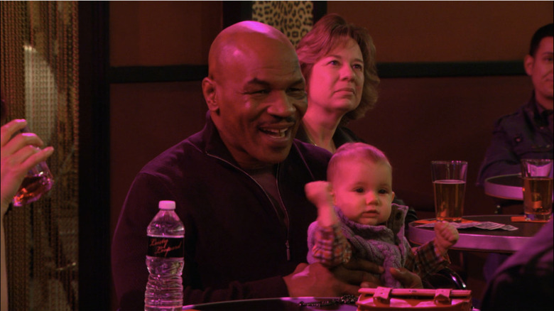 Mike Tyson holds a baby on "How I Met You Mother" 