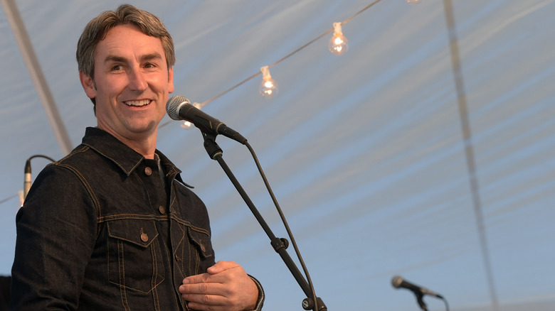 Mike Wolfe smiling at microphone