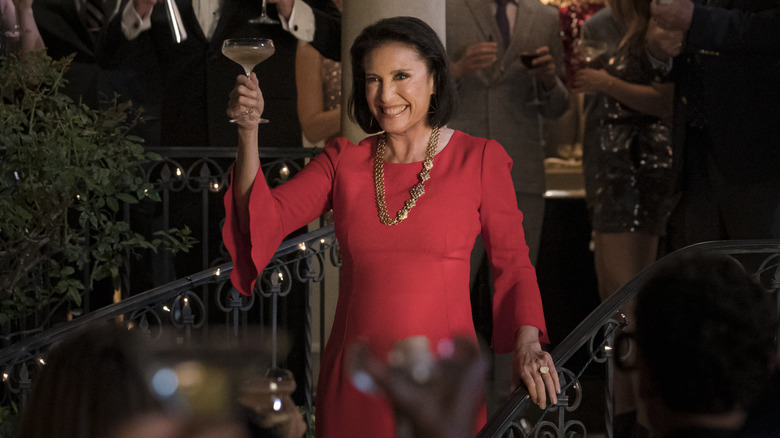 Mimi Rogers toasting