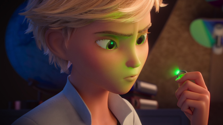 Adrien Agreste looking at Cat Noir ring