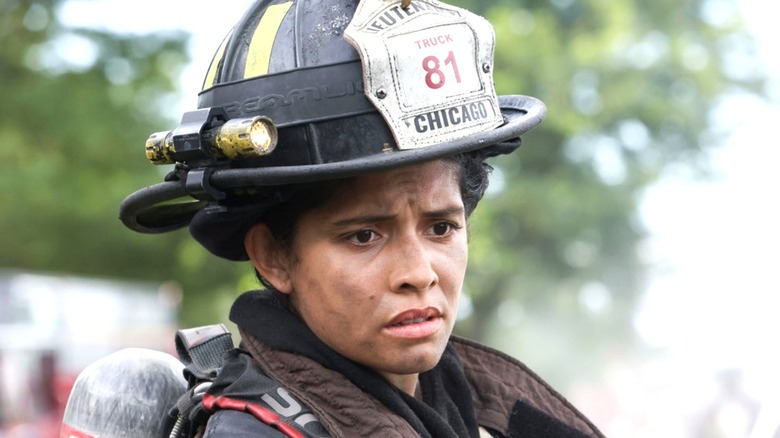 Stella Kidd in firefighter helmet