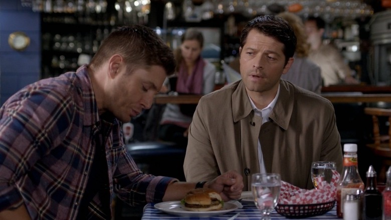 Castiel watching Dean eat