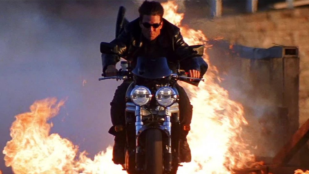 Tom Cruise performs a motorcycle stunt in Mission: Impossible 2