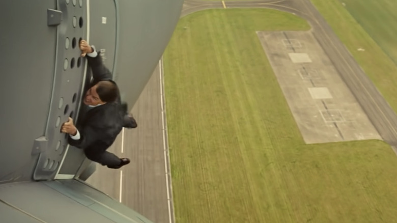 Ethan Hunt hanging from an airplane in Rogue Nation