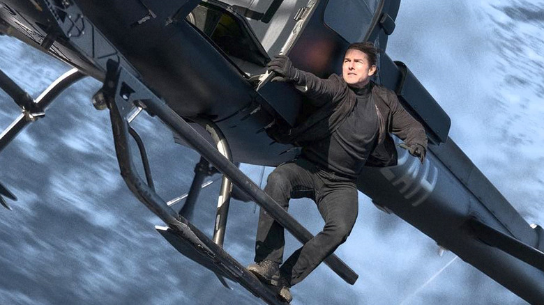 Tom Cruise hanging onto helicopter 