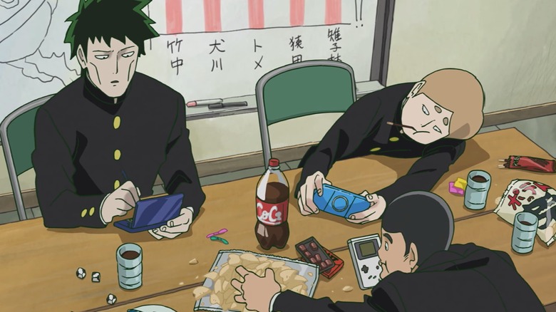 The guys with snacks and handhelds