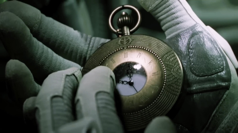 Iria Sorari holding pocket watch