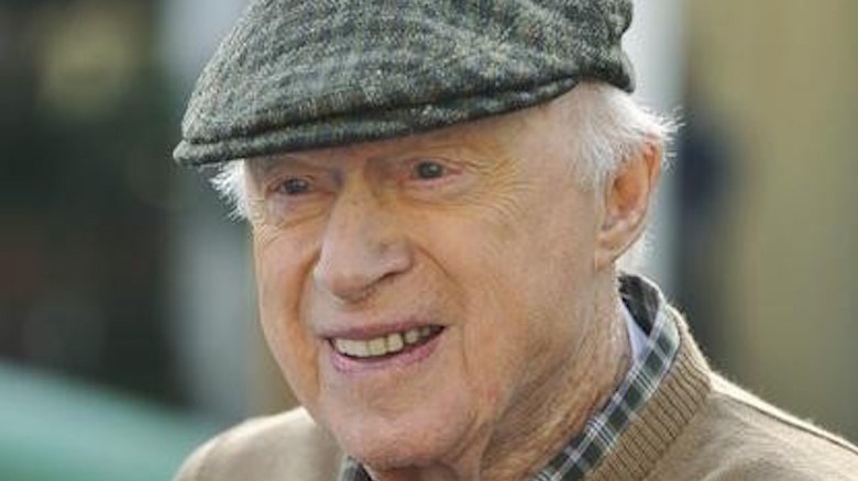 Norman Lloyd smiles