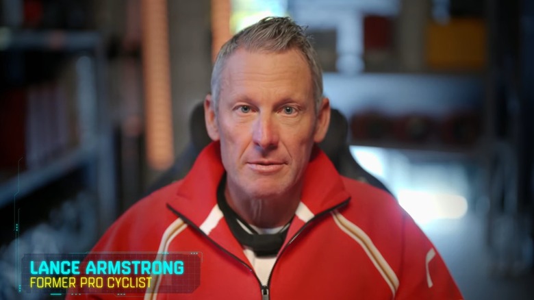 Lance Armstrong in a red jumpsuit